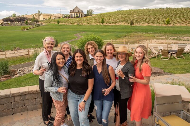 A group of women pose for a photo at the Ste Chapelle Winery in Nampa.