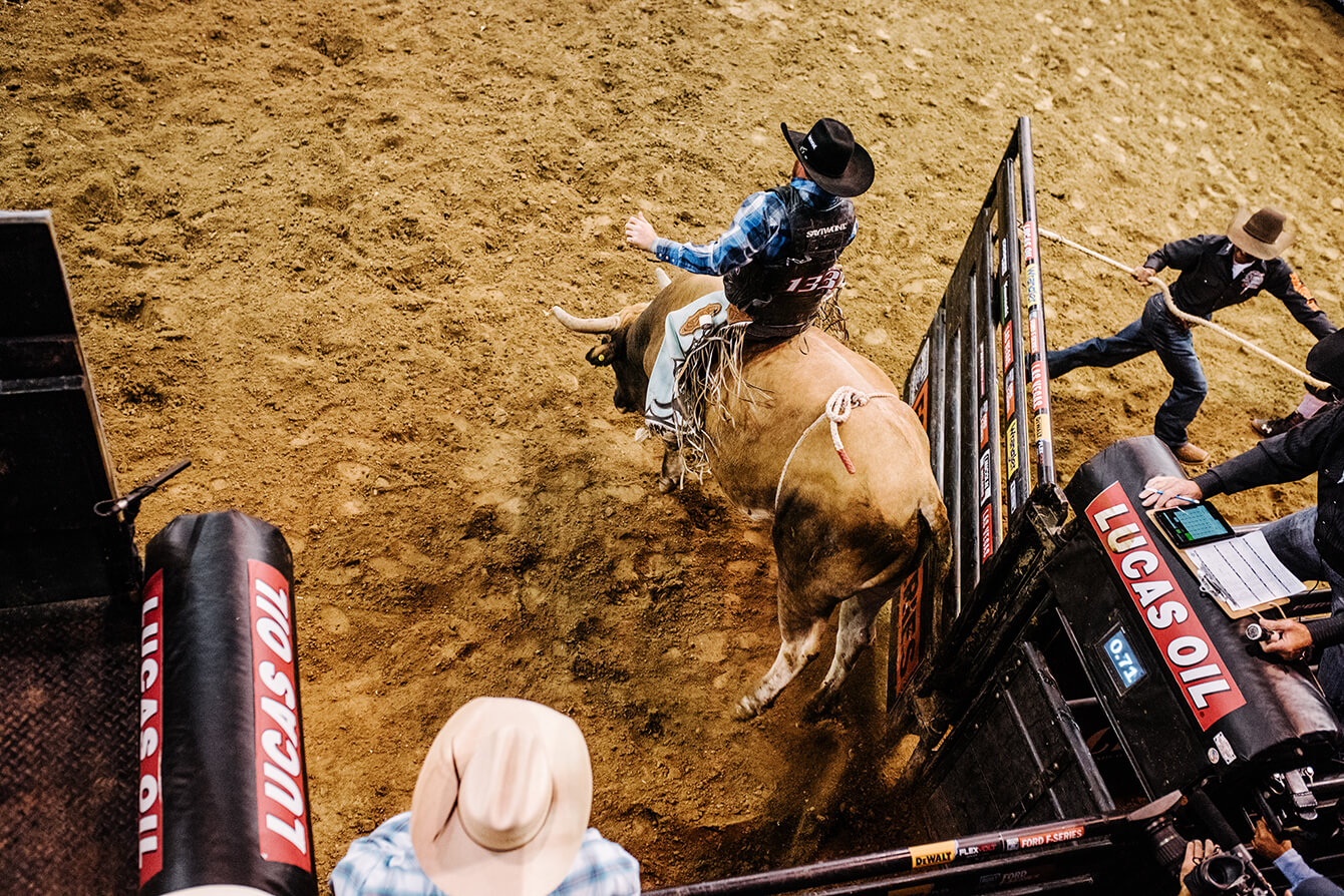 A bull rider emerges from the gates at the Snake River Stampede Rodeo.