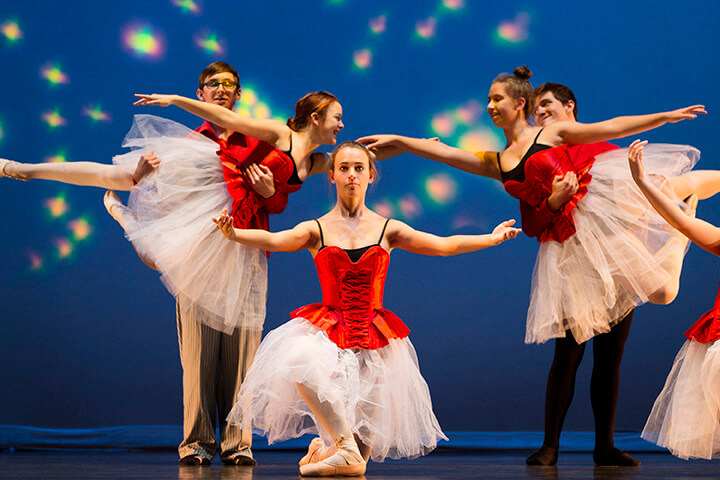 A group of ballerinas performing on stage in Nampa.